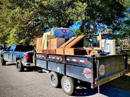 A dump trailer used for a Clear The Clutter removal job.